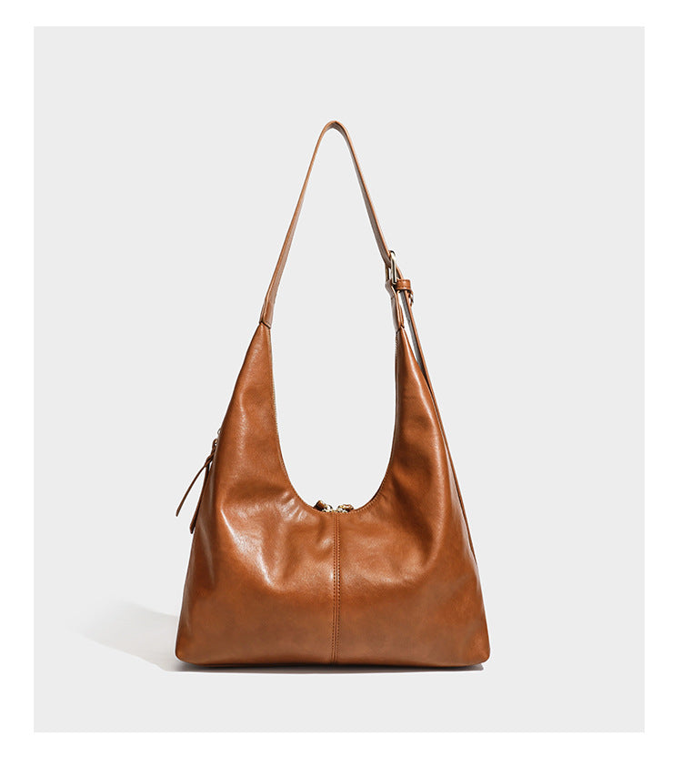 Lässig fallende Hobo-Schultertasche mit strukturierter Wildlederoptik, Reißverschluss oben, Quasten-Zippern und goldfarbenem, verstellbarem