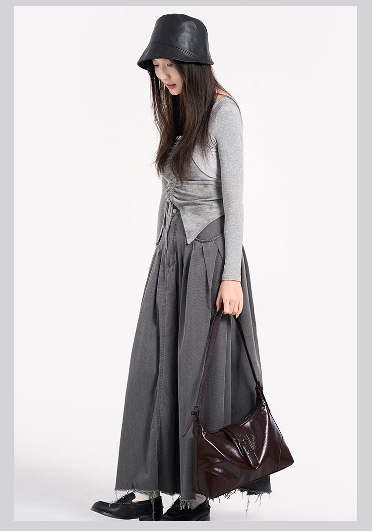 Glossy dark brown slouch hobo shoulder bag with front buckle strap panel and long adjustable single strap, detail view 22