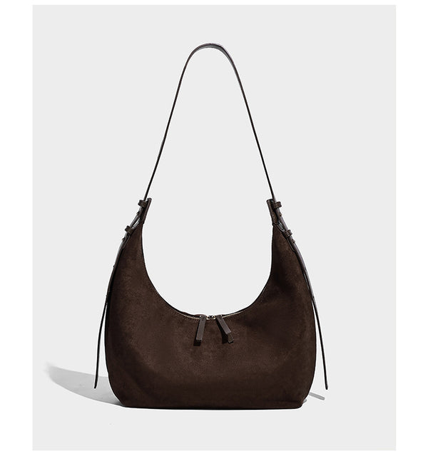 Slouchy crescent hobo shoulder bag in dark chocolate matte suede-look finish with adjustable strap and twin-pull top zip