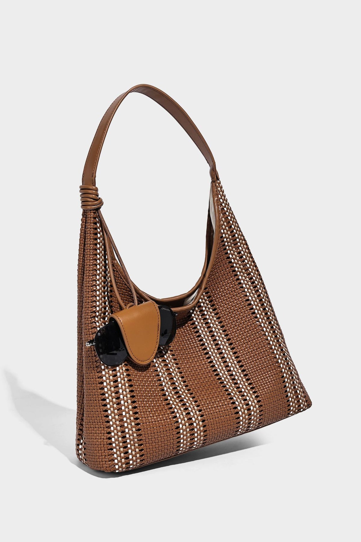 Woven striped slouch shoulder tote bag with knotted strap and attached front flap pouch, detail view 23