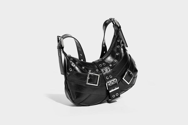 Glossy crescent hobo bag with silver-tone grommets, square buckle straps, and top zipper closure, detail view 26