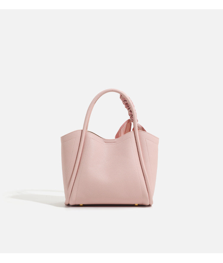 Pebbled leather-look bucket tote bag with scarf-wrapped top handle and gold-tone hardware, detail view 13
