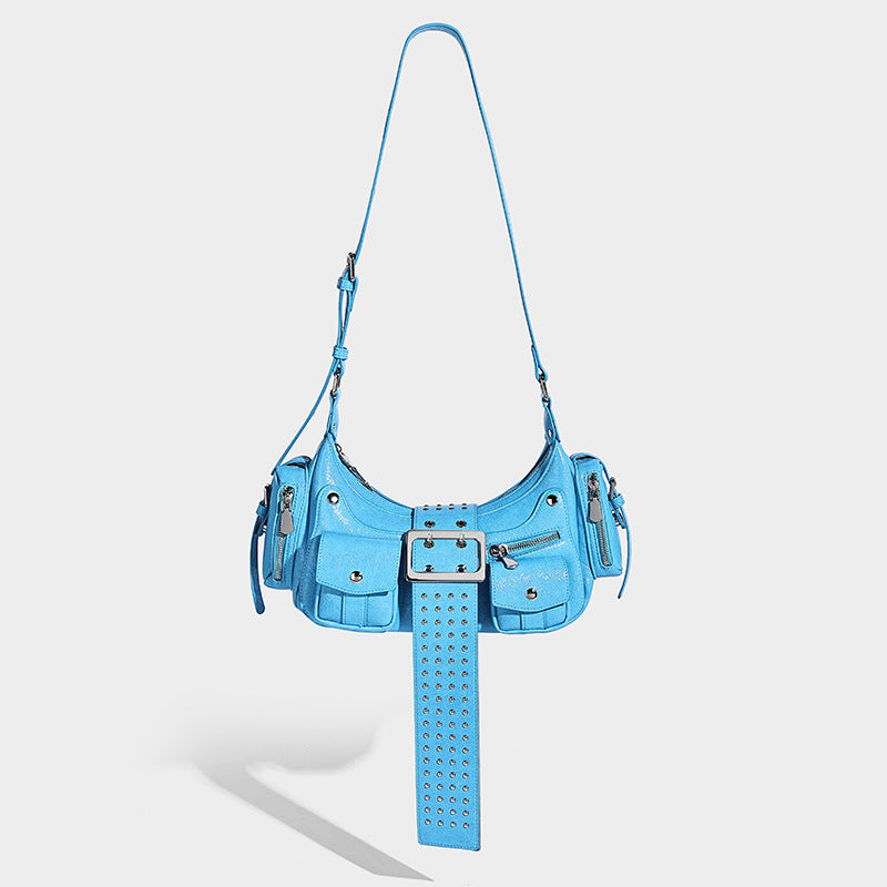 Crescent shoulder bag with studded belt buckle tab, multiple front pockets, and silver-tone hardware, front view