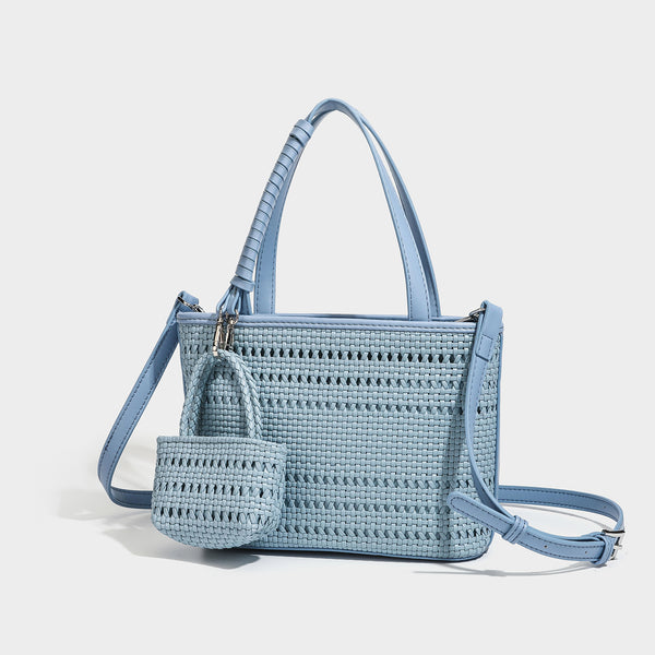 Structured open-weave tote bag with smooth leather-look trim, double top handles, detachable crossbody strap, and mini zip