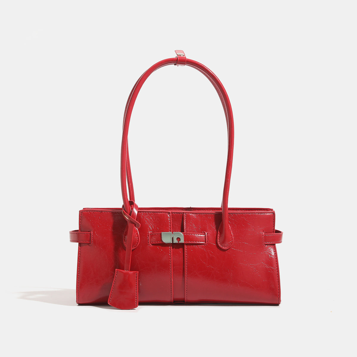 Structured glossy leather-look tote bag with long loop handles and silver turn-lock buckle closure, detail view 7