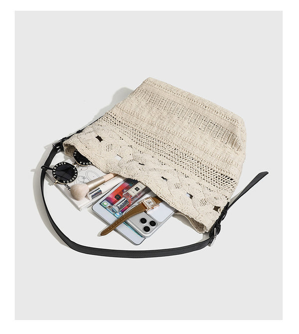 Cream woven rope-cord hobo bag with black adjustable leather-look strap and matching cream drawstring pouch, detail view 13