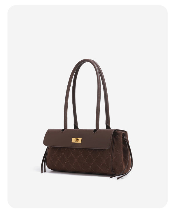 Structured rectangular baguette shoulder bag with diamond quilted lower panel, smooth flap, gold-tone turn-lock closure