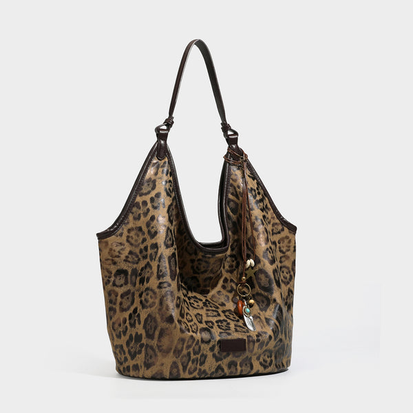 Large slouchy leopard-print shoulder tote bag with glossy tan-and-brown finish, dark brown leather-look trim, single