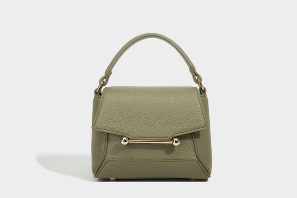 Small structured pebbled flap mini satchel with gold-tone bar hardware, short top handle, and detachable crossbody strap