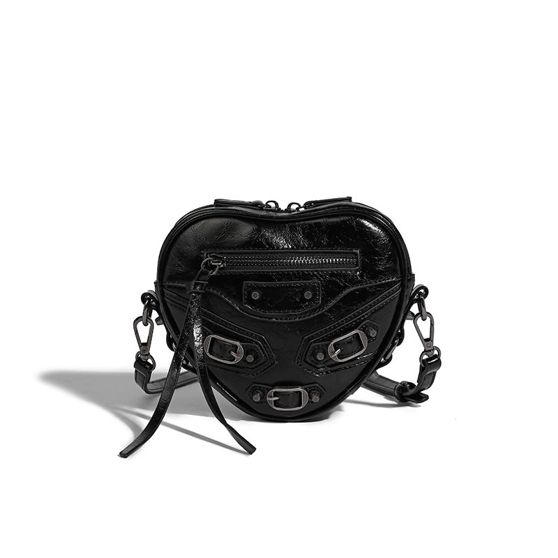 Mini heart-shaped crossbody bag with glossy crinkled finish and moto buckle hardware, detail view 15