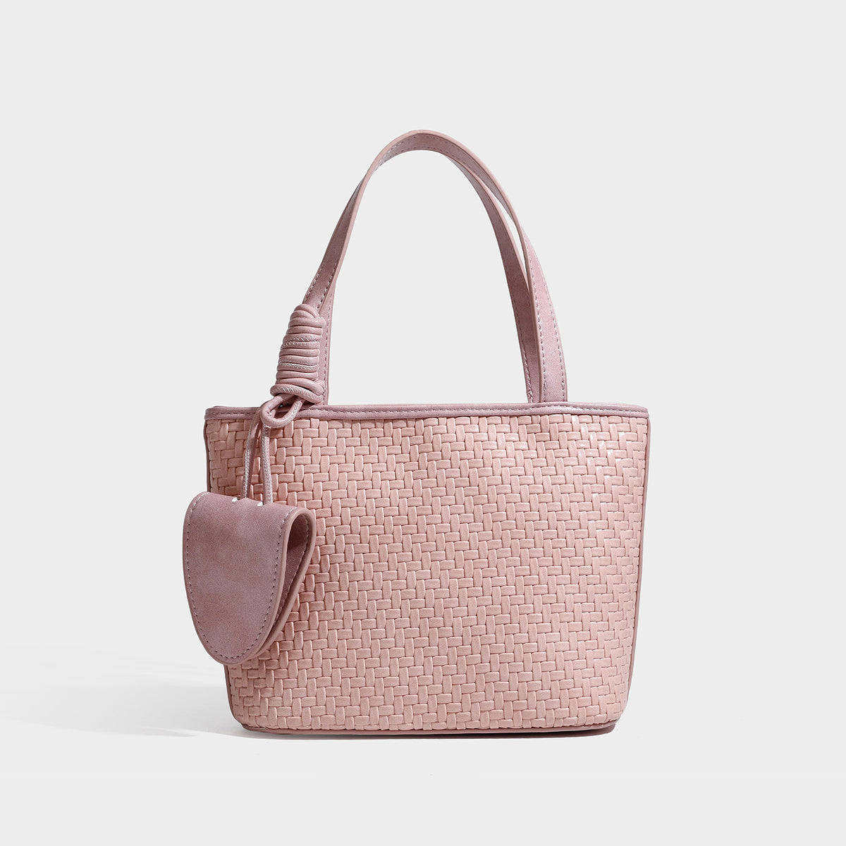 Strukturierte Tote-Bag mit Webstruktur in Braun und goldfarbenen Beschlägen, mit Seil umwickelten Tragegriffen, kleiner Fronttasche sowie, Detailansicht