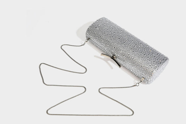 Structured rectangular hard-case clutch bag covered in all-over rhinestone crystal embellishment with curved kiss-lock top