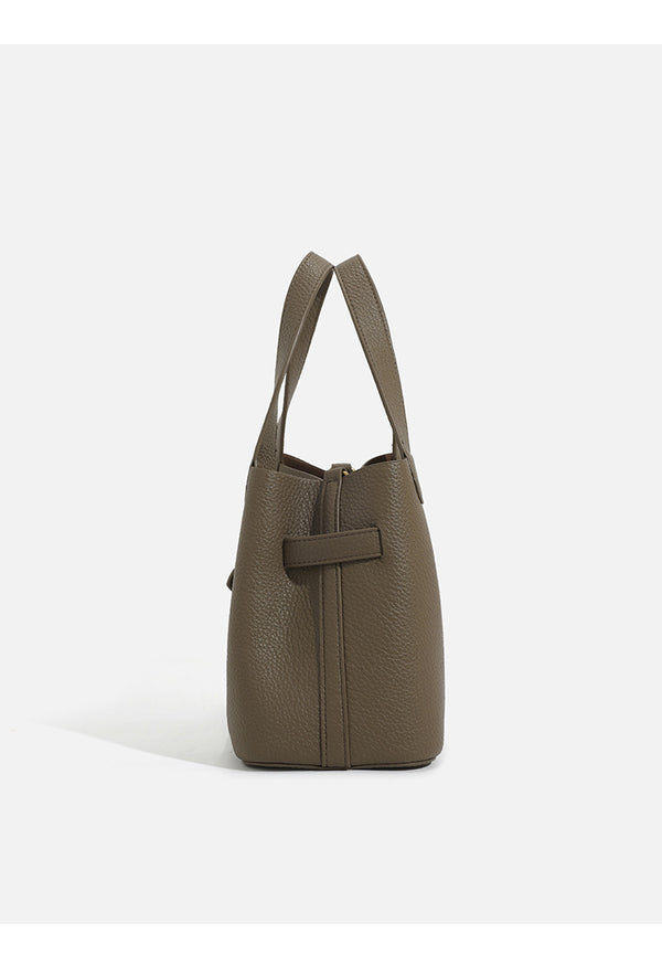 Pebbled trapezoid tote bag with gold turn-lock strap detail and matching snap pouch, detail view 10