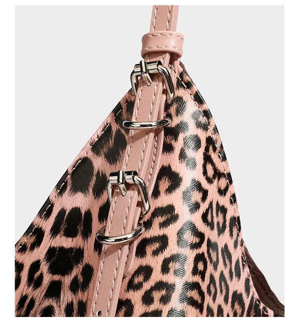 Large leopard print shoulder tote bag with glossy finish, long double straps, front zip pocket, silver-tone hardware, and