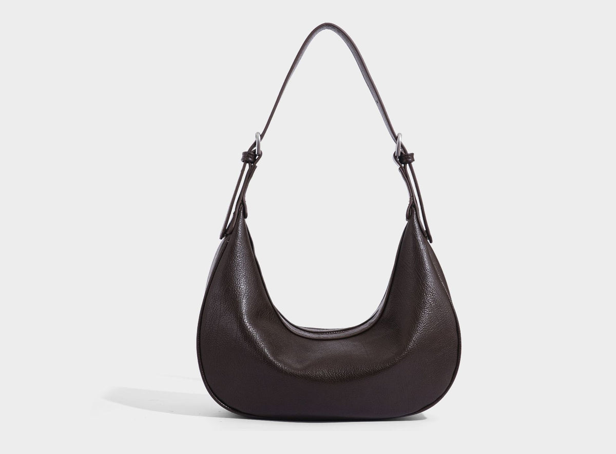 Crescent half-moon shoulder bag in pebbled leather-look finish with adjustable strap and silver-tone hardware, detail view 31