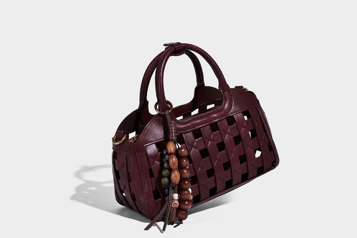 Small structured woven lattice top-handle satchel bag with bead-and-tassel charm and gold-tone hardware, detail view 33