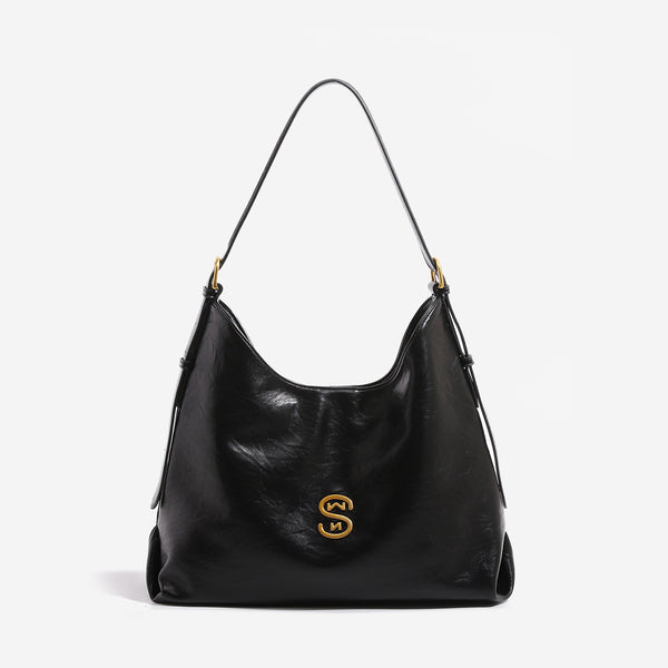 Crinkled leather-look hobo shoulder bag with gold-tone logo emblem and slim adjustable strap, detail view 7