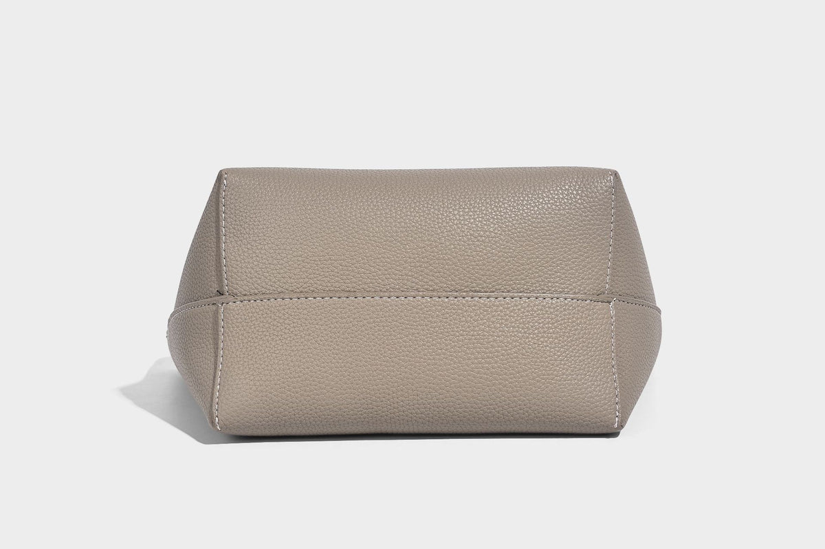 Structured pebbled leather-look tote bag in taupe with long shoulder strap, detachable zip pouch, and pink tulip flower