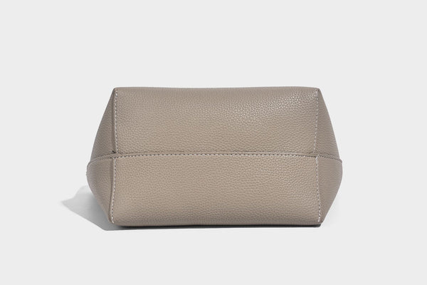 Structured pebbled leather-look tote bag in taupe with long shoulder strap, detachable zip pouch, and pink tulip flower