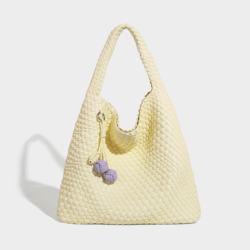Soft hand-woven slouchy hobo tote bag with knotted tassel charm and single looped shoulder strap, detail view 20
