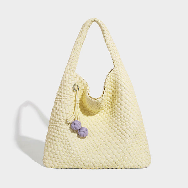 Soft hand-woven slouchy hobo tote bag with knotted tassel charm and single looped shoulder strap, detail view 20