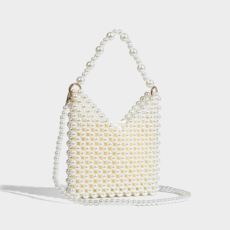 Small silver metallic beaded mini bag with braided rhinestone top handle and detachable chain crossbody strap, front view