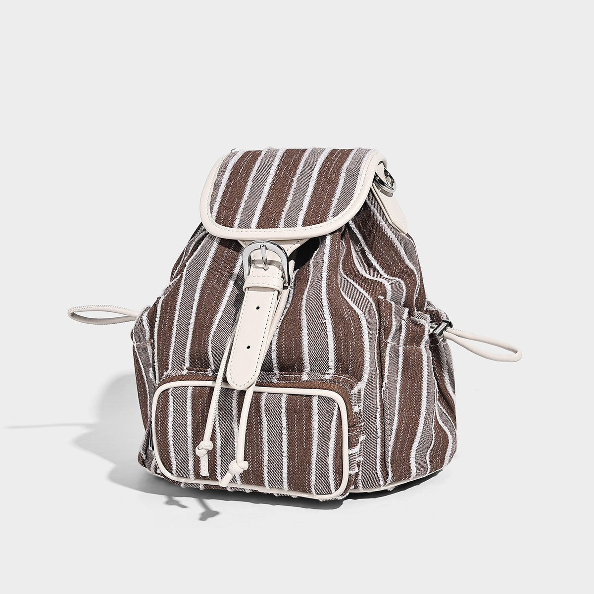 Soft woven vertical-stripe drawstring backpack with flap top, front zip pocket, white leather-look trim and straps, front