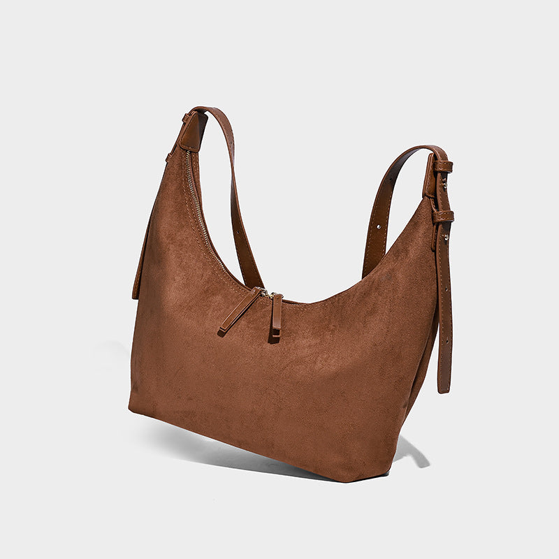 Slouchy crescent hobo shoulder bag in dark chocolate matte suede-look finish with adjustable strap and twin-pull top zip