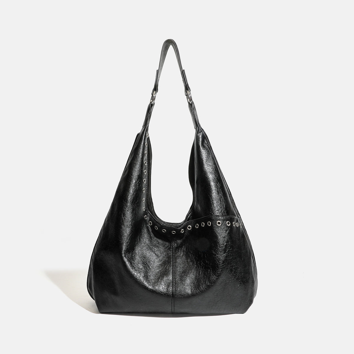 Large slouchy hobo shoulder bag with silver eyelet trim and glossy leather-look finish, detail view 6