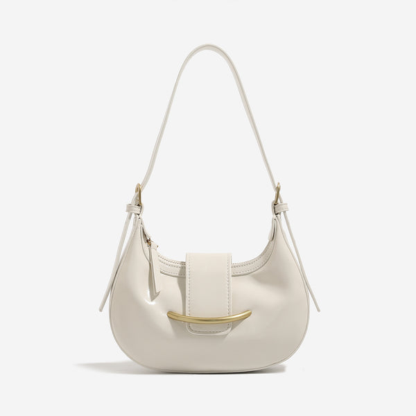 Compact crescent hobo shoulder bag with glossy synthetic finish, curved gold-tone front bar hardware, zip-top closure, and