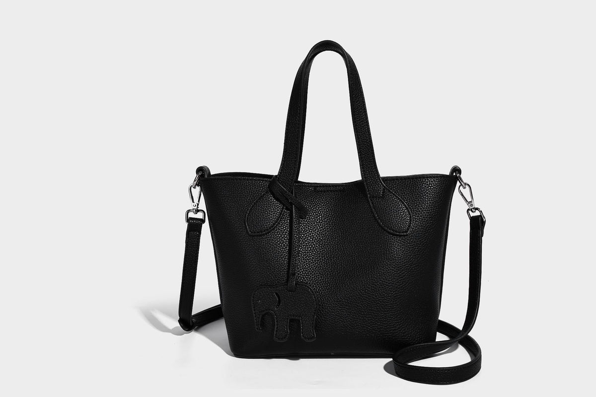 Compact pebbled bucket tote bag with elephant charm, twin top handles, and detachable crossbody strap, detail view 24