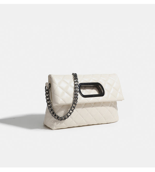 Quilted diamond-stitch flap crossbody bag with gunmetal chain strap and cut-out bar handle, detail view 13