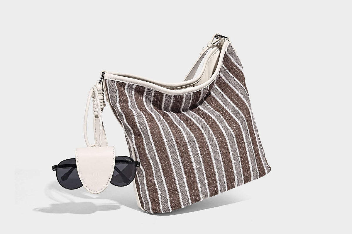 Large striped canvas hobo shoulder bag with cream trim and silver-tone hardware, detail view 13