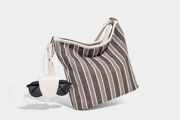 Large striped canvas hobo shoulder bag with cream trim and silver-tone hardware, detail view 13