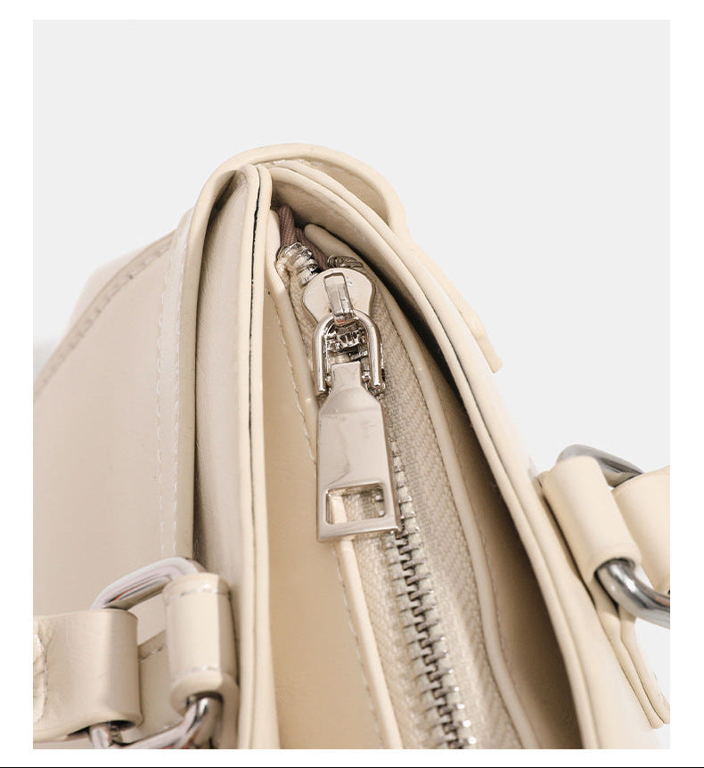 Glossy leather-look baguette shoulder bag with silver-tone hardware and buckle-strap detail, detail view 14