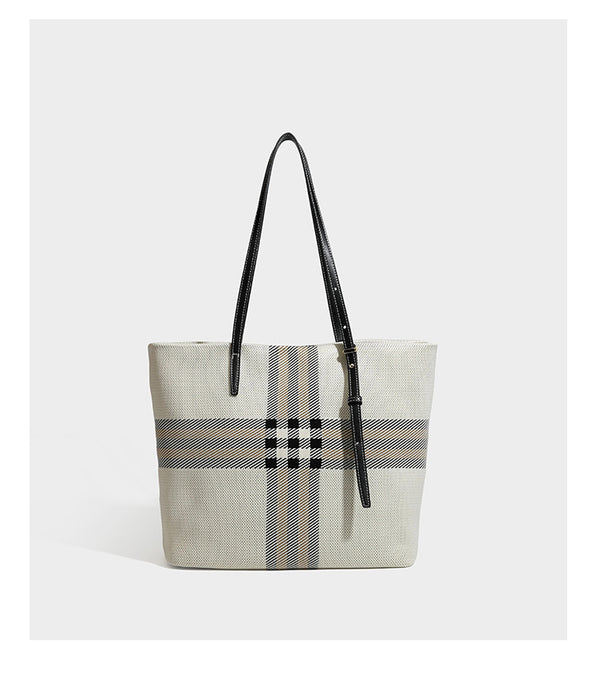 Large structured plaid check tote bag with smooth tan leather-look shoulder straps, attached front zip pouch, and gold-tone