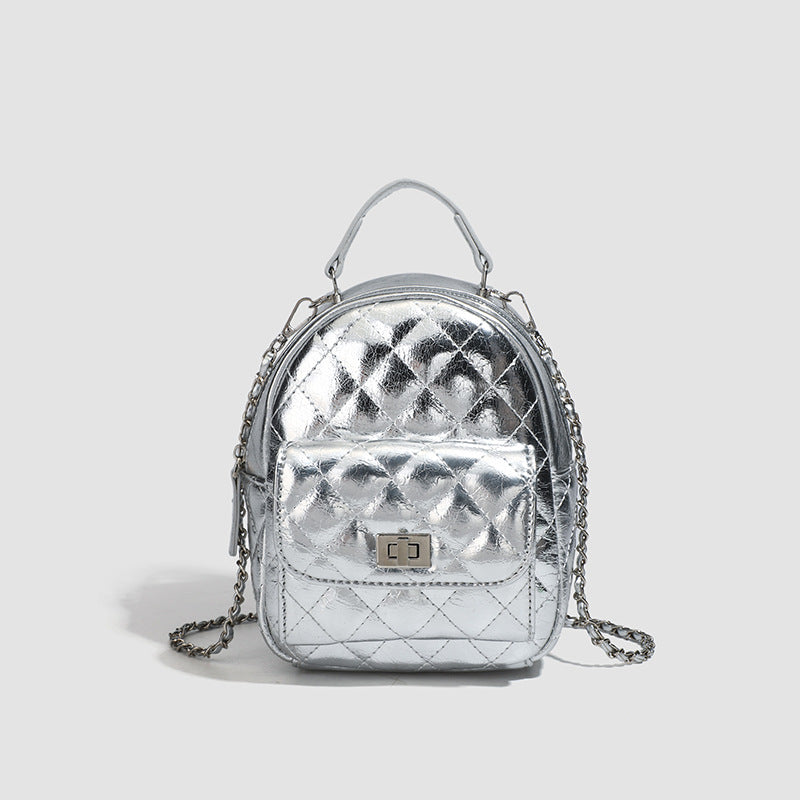 Quilted leather-look backpack purse with chain strap and turn-lock front pocket, detail view 9