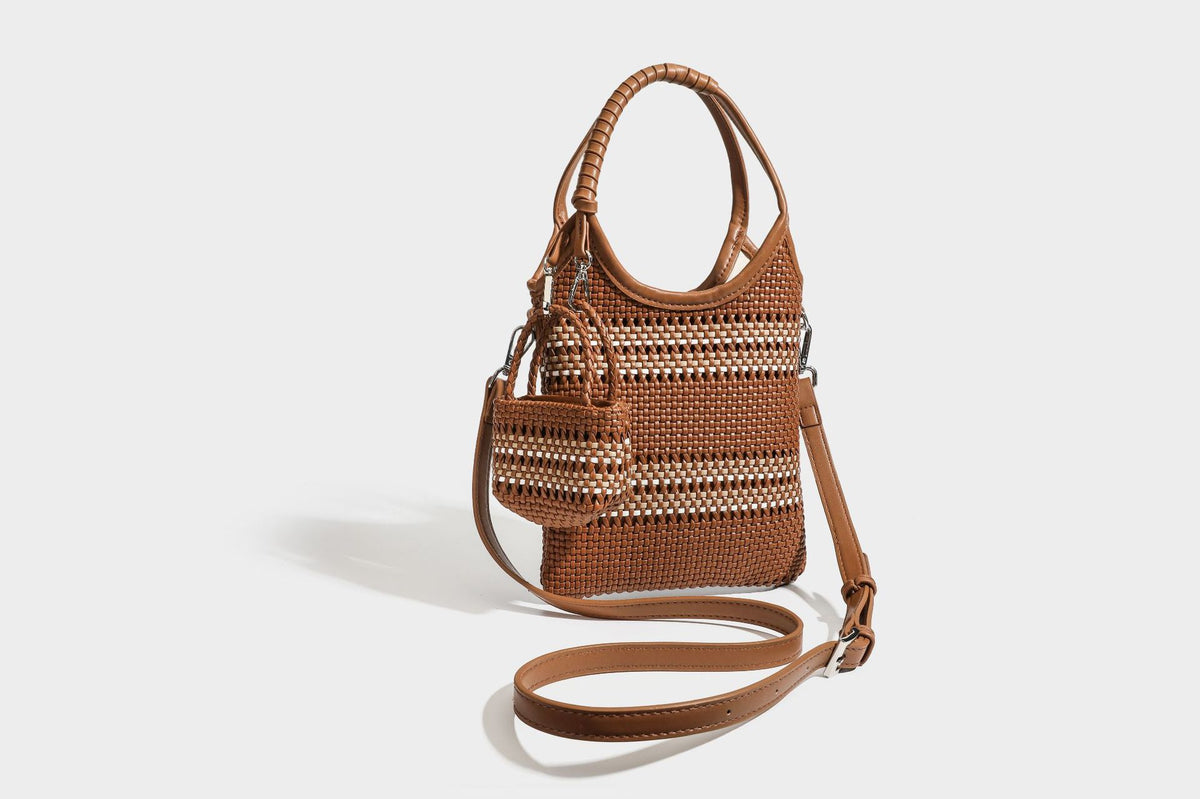 Color-block woven tote bag with rounded leather-look handles, detachable crossbody strap, and matching mini clip-on pouch in