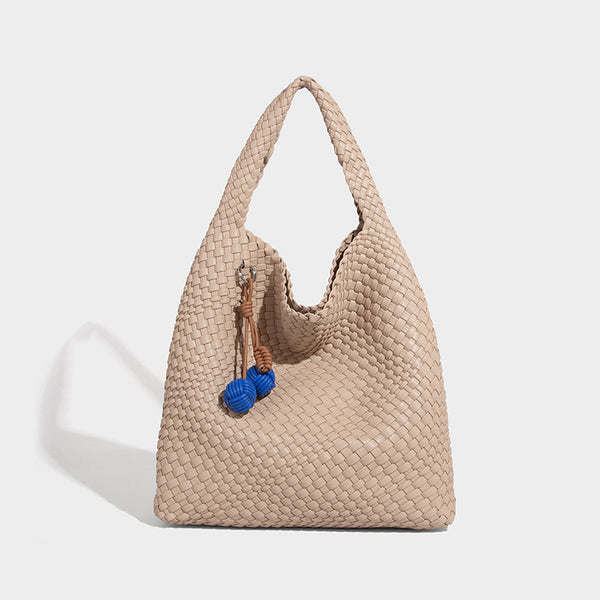 Soft hand-woven slouchy hobo tote bag with knotted tassel charm and single looped shoulder strap, detail view 3