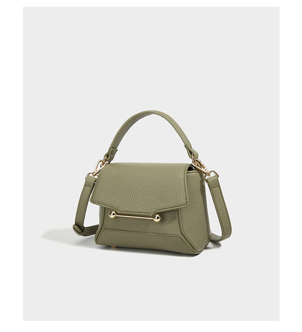 Small structured pebbled flap mini satchel with gold-tone bar hardware, short top handle, and detachable crossbody strap
