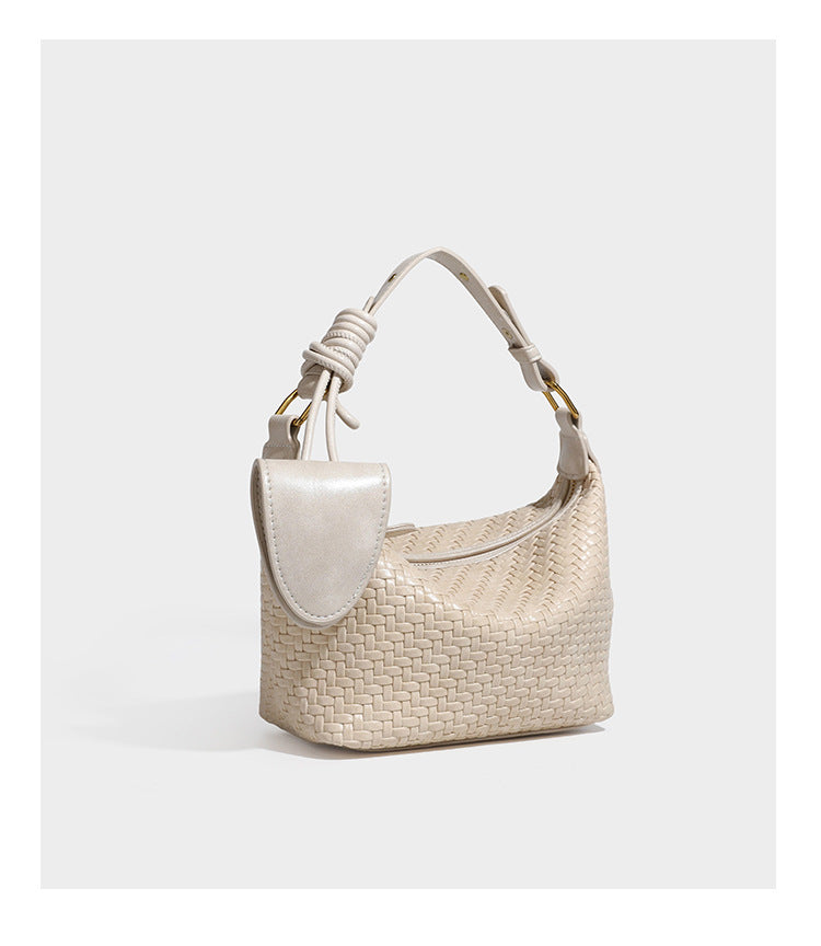 Small glossy basket-weave hobo shoulder bag in brown with knotted top handle, flap accent pocket, and gold-tone hardware