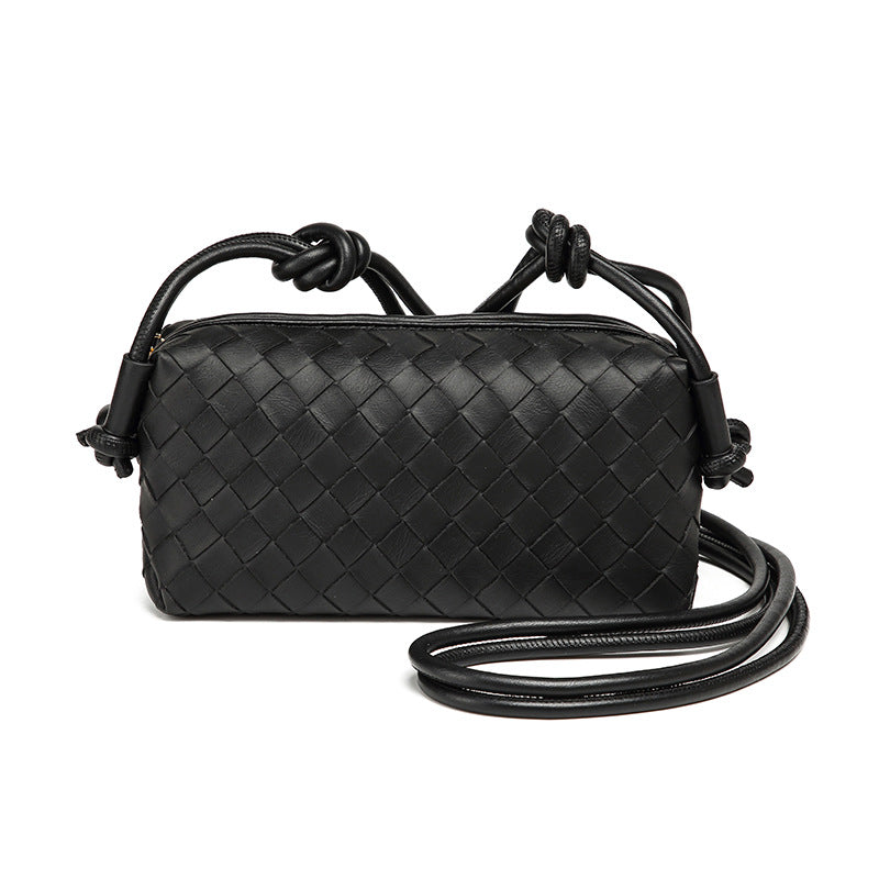 Small rectangular woven-texture mini crossbody bag with knotted rope strap and gold-tone zip closure, detail view 5
