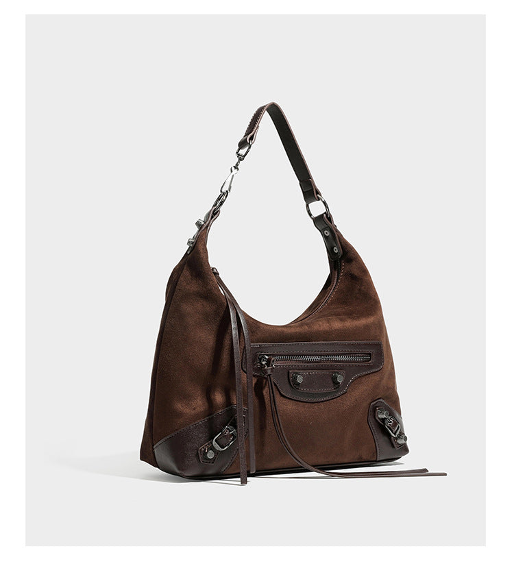Slouchy suede-finish hobo shoulder bag with dark hardware, exterior zip pocket, tassel ties, and detachable crossbody strap