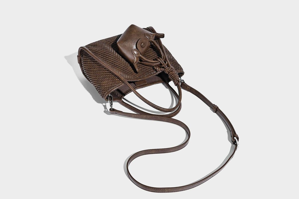 Large structured woven rope-texture tote bag with smooth leather-look trim, knotted dual top handles, detachable mini front