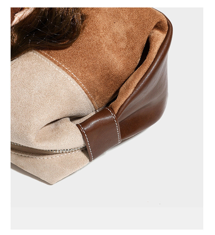 Patchwork suede-look barrel shoulder bag in brown, rust, tan, beige, and gray panels with double leather-look straps and