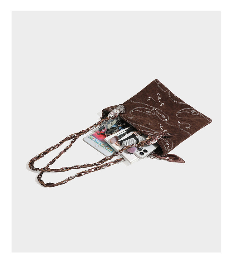 Brown suede-finish tote bag with paisley embroidery and braided fabric-ribbon shoulder strap, detail view 28