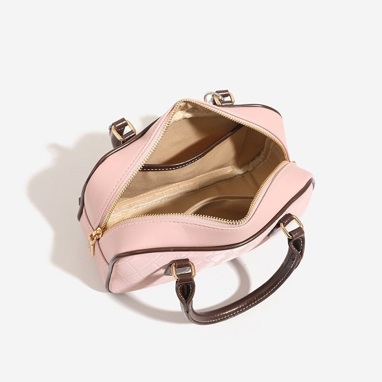 Small structured blush pink quilted diamond Boston barrel bag with brown leather-look trim, double top handles, heart accent