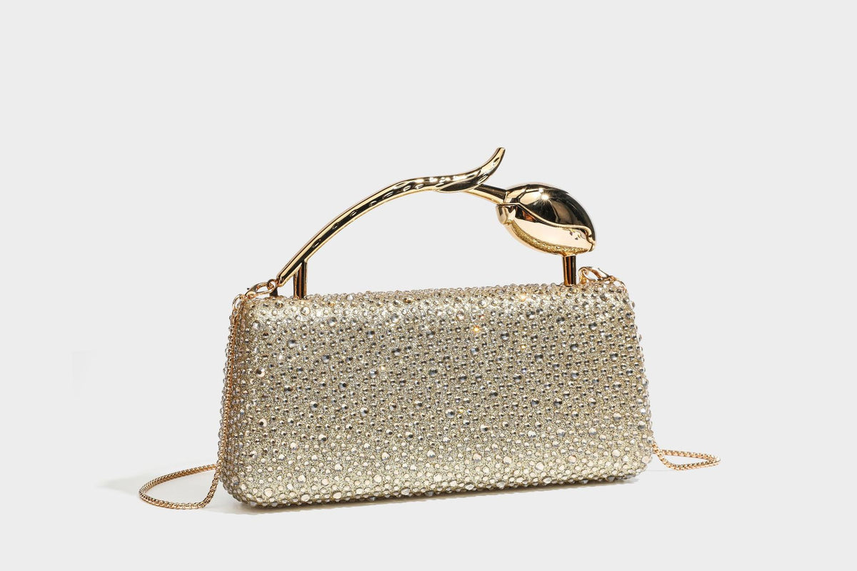 rectangular hard-case rhinestone evening clutch with sculptural gold-tone branch-and-bud top handle and detachable chain