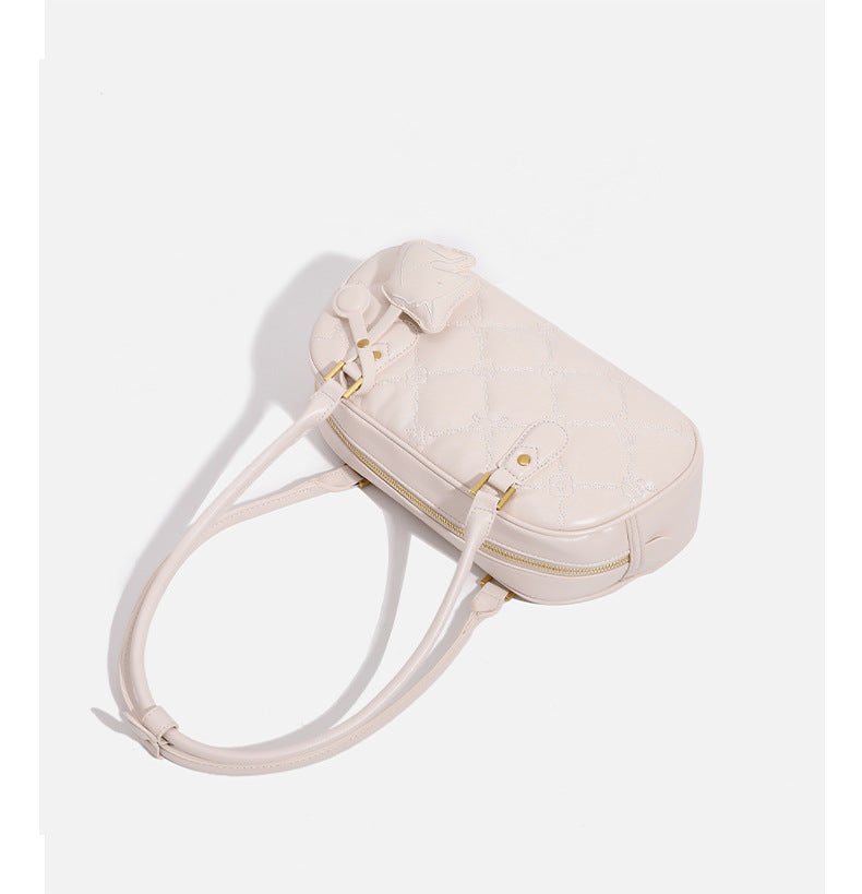 Small structured quilted leather-look zip shoulder bag with gold-tone hardware and adjustable strap, detail view 16