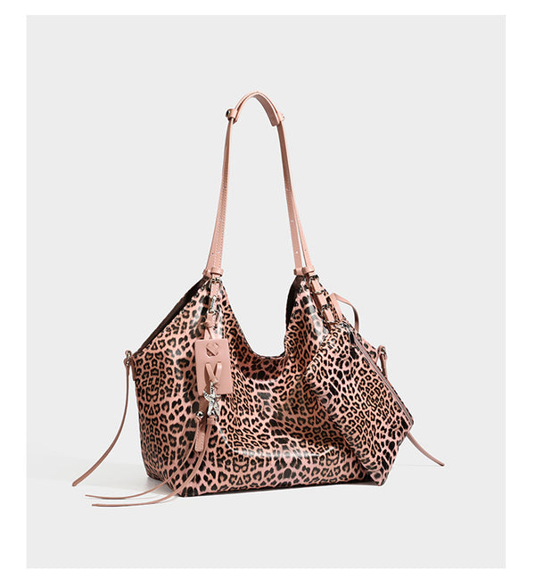 Large leopard print shoulder tote bag with glossy finish, long double straps, front zip pocket, silver-tone hardware, and